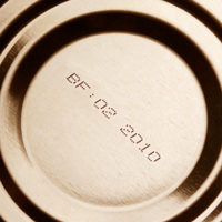 Close-up of canned food with expiration date